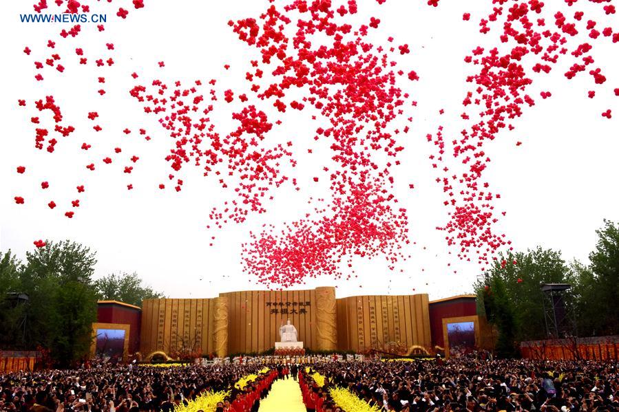 Balloons float during an ancestor worship grand ceremony in honor of Huangdi, the Yellow Emperor, held at mausoleums in Xinzheng, central China's Henan Province, Huangdi's birth place, on April 9, 2016, the third day of the third month on the Chinese lunar calendar, which is considered the birthday of Huangdi. 