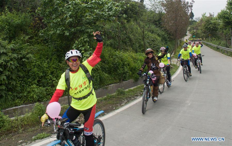 Riders attend the wedding of Zeng Di and Wang Lixia in Chengdu, capital of southwest China's Sichuan Province, April 9, 2016. 