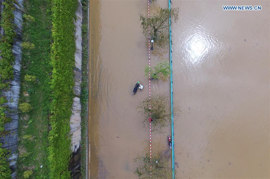 Aerial photo taken on April 11, 2016 shows flood submerging city streets in Liuzhou, south China's Guangxi Zhuang Autonomous Region. 