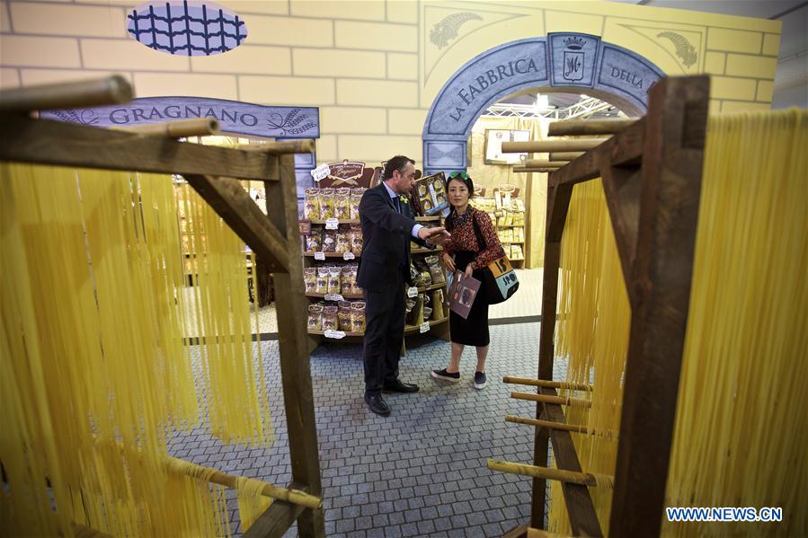 A visitor tastes the wine at Italy's Lombardy hall during Vinitaly in Verona, Italy, on April 11, 2016. Vinitaly 2016, the 50th edition of this international wine fair, began Sunday and will run until Wednesday, April 13. 