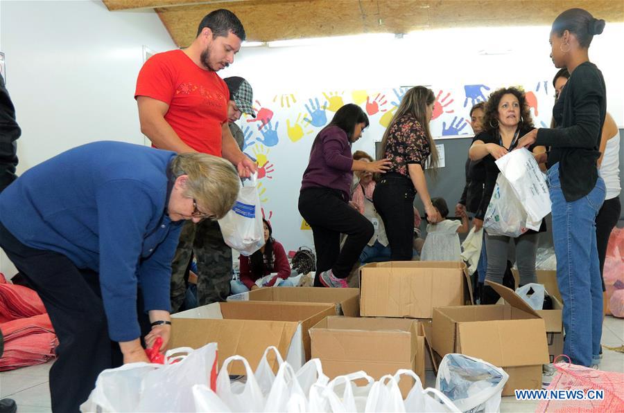 Image provided by Public News Agency of Ecuador and South America ANDES shows people organizing relief supplies to be transported to the affected areas by the earthquake in a collecion center installed at the Ministry of Economic and Social Inclusion (MIES, for its acronym in Spanish), in the city of Quito, Ecuador, on April 18, 2016.