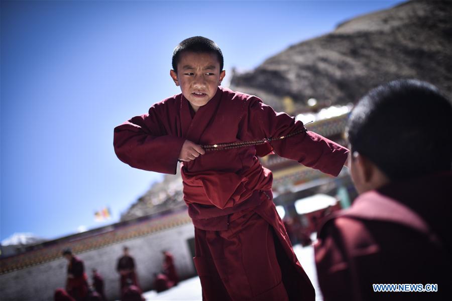 A young monk debates on Tibetan Buddhism doctrines at Labu Monastery in Yushu Tibetan Autonomous Prefecture, northwest China's Qinghai Province, April 18, 2016.