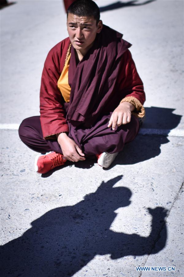 A monk debates on Tibetan Buddhism doctrines at Labu Monastery in Yushu Tibetan Autonomous Prefecture, northwest China's Qinghai Province, April 18, 2016. 