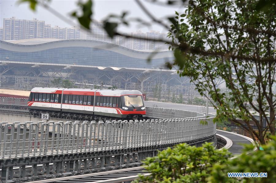 A train runs on the magnetic levitation line in Changsha, capital of central China's Hunan Province, May 5, 2016. 