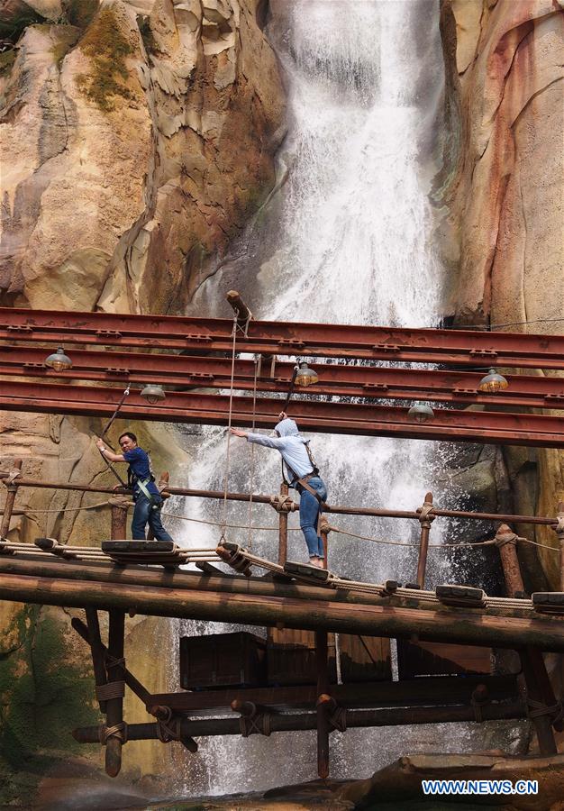 Visitors join in the Camp Discovery in the Adventure Isle of the Disney Resort in Shanghai, east China, May 11, 2016. 