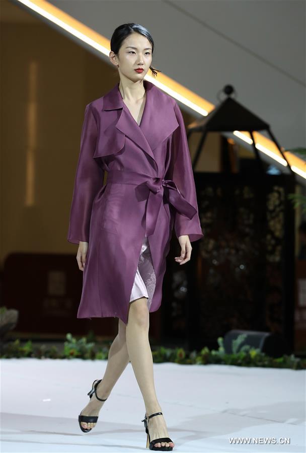 A model presents a creation of designer Zhang Yihua during the 16th China (Qingdao) International Fashion Week in Qingdao, east China's Shandong Province, May 12, 2016