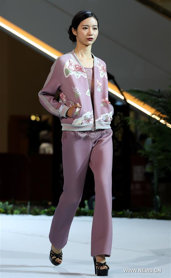 A model presents a creation of designer Zhang Yihua during the 16th China (Qingdao) International Fashion Week in Qingdao, east China's Shandong Province, May 12, 2016