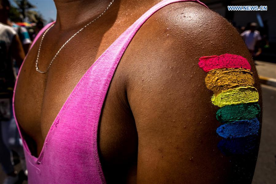 A participant displays a rainbow mark during a march against homophobia, in Havana, capital of Cuba, on May 14, 2016.