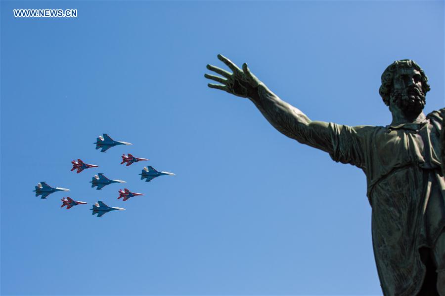 Military jets fly in formation during the Victory Day parade in Moscow, Russia, May 9, 2016. 