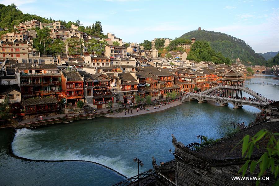 Fenghuang, which means 'phoenix' in Chinese, is known for its well-preserved architecture and traditional river town scenery. 