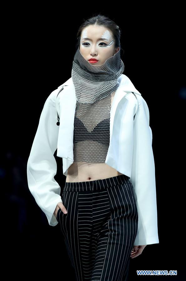 A model shows a creation of graduates from the Southwest University during the China Graduate Fashion Week in Beijing, capital of China, May 17, 2016.