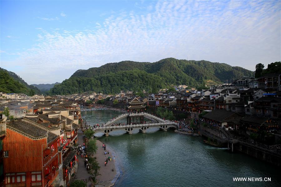 Fenghuang, which means 'phoenix' in Chinese, is known for its well-preserved architecture and traditional river town scenery. 