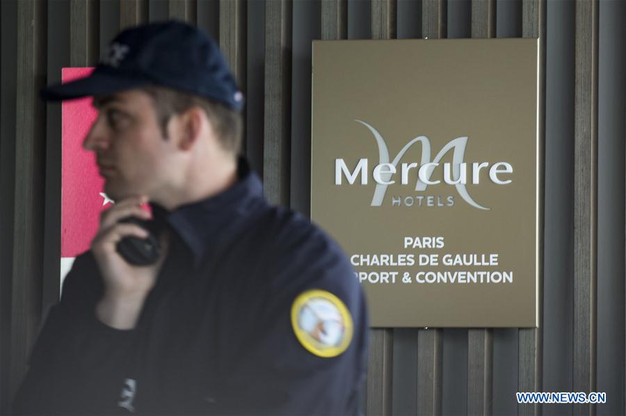 Police stand guard outside the Mercure Hotel next to the Roissy Charles de Gaulle Airport, where relatives of those on the missing plane gather, in Paris, France, May 19, 2016. 