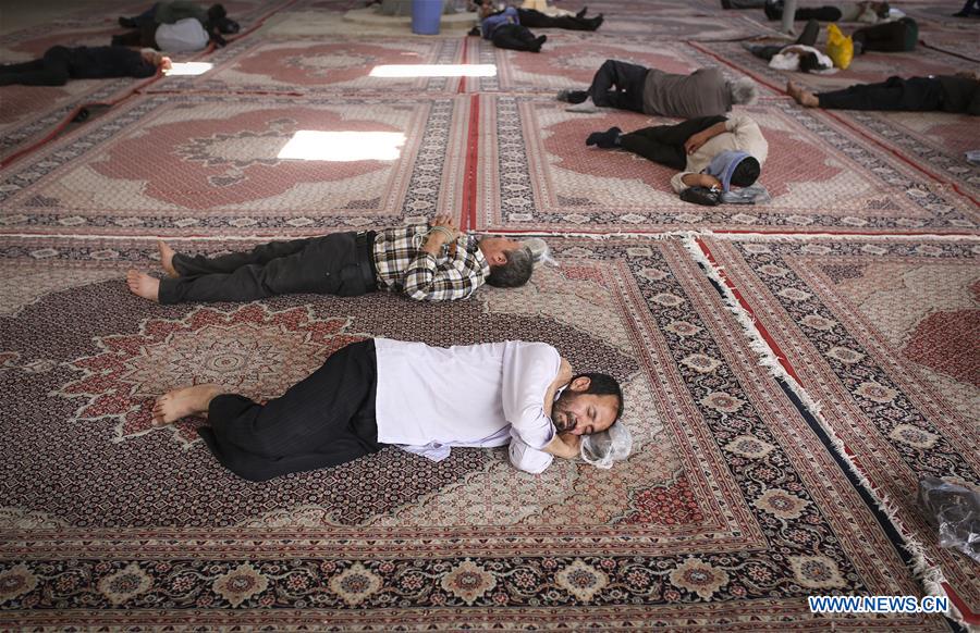 Muslims pray during the holy month of Ramadan in a mosque at the shrine of Shiite Saint Abdulazim in Shahr-e Rey, south of Tehran, Iran, June 13, 2016.