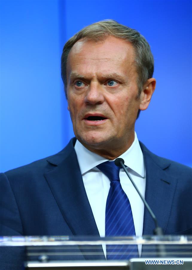 European Council President Donald Tusk (C) and European Commission President Jean-Claude Juncker (L) attend a press conference at the EU headquarters in Brussels, Belgium, June 29, 2016. 