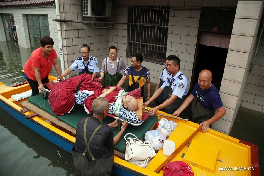 Flood caused by heavy rain forced local residents to relocate on Tuesday.