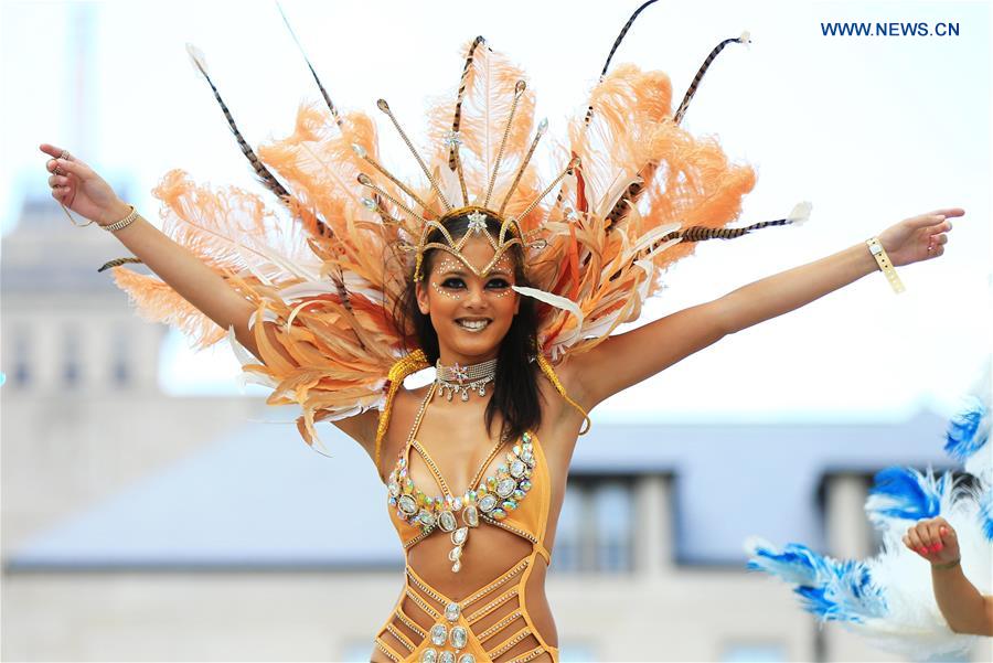 A dressed up reveller performs during the official launch ceremony of the 2016 Toronto Caribbean Carnival at Nathan Philips Square in Toronto, Canada, July 5, 2016.
