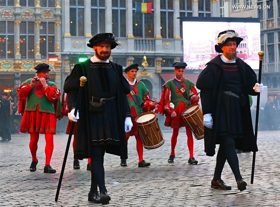 Performers participate in the annual procession of Ommegang at the Grand Place of Brussels, capital of Belgium, July 5, 2016.
