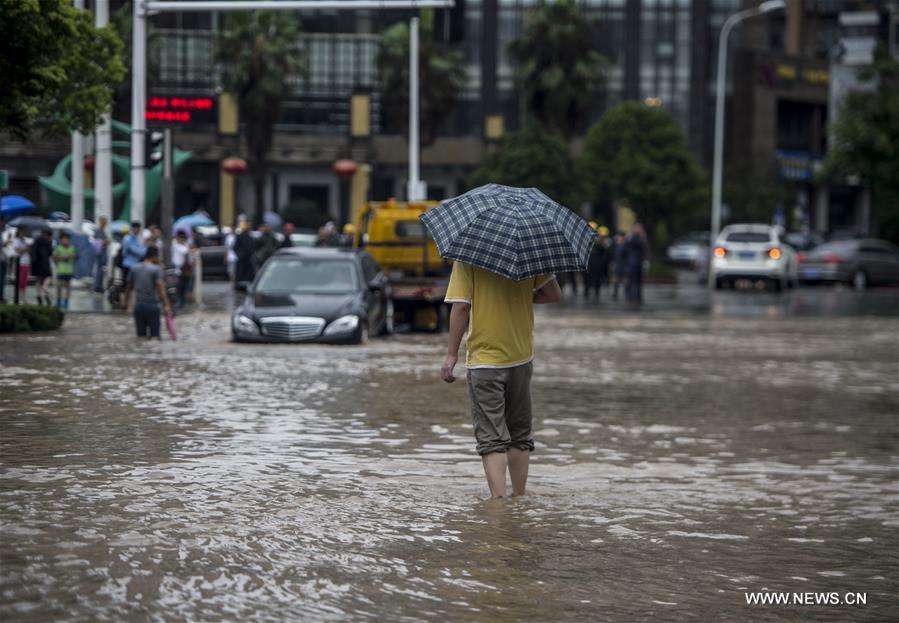 The downpour caused severe waterlogging as rivers, lakes and reservoirs of the city have swollen, leading to closure of a tunnel across the Yangtze as well as some subway stations and underground passages, according to local traffic authorities. 