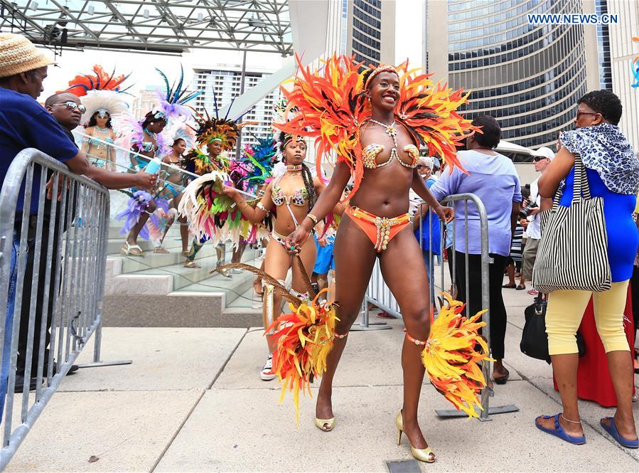 Dressed up revellers perform during the official launch ceremony of the 2016 Toronto Caribbean Carnival at Nathan Philips Square in Toronto, Canada, July 5, 2016. 