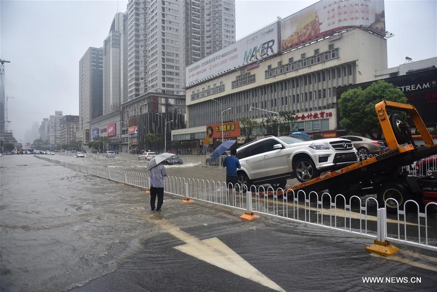 The downpour caused severe waterlogging as rivers, lakes and reservoirs of the city have swollen, leading to closure of a tunnel across the Yangtze as well as some subway stations and underground passages, according to local traffic authorities. 