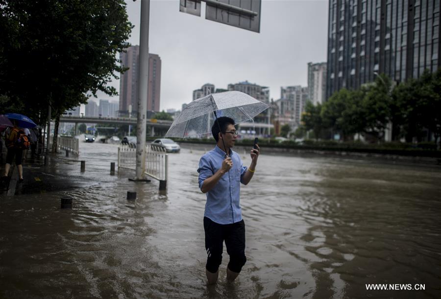 The downpour caused severe waterlogging as rivers, lakes and reservoirs of the city have swollen, leading to closure of a tunnel across the Yangtze as well as some subway stations and underground passages, according to local traffic authorities. 