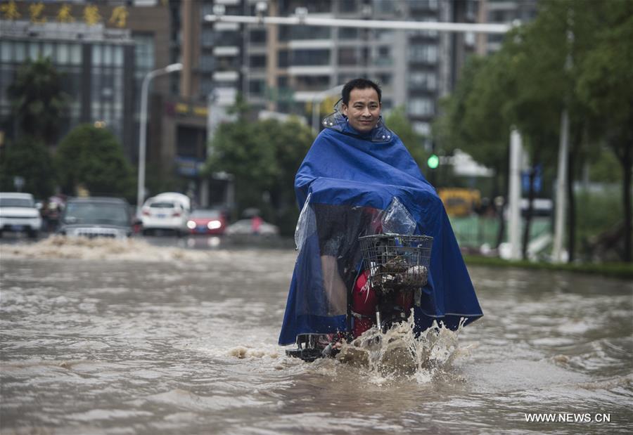 The downpour caused severe waterlogging as rivers, lakes and reservoirs of the city have swollen, leading to closure of a tunnel across the Yangtze as well as some subway stations and underground passages, according to local traffic authorities. 