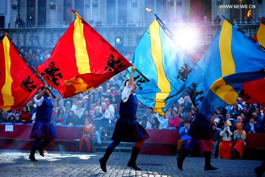 Performers participate in the annual procession of Ommegang at the Grand Place of Brussels, capital of Belgium, July 5, 2016. 