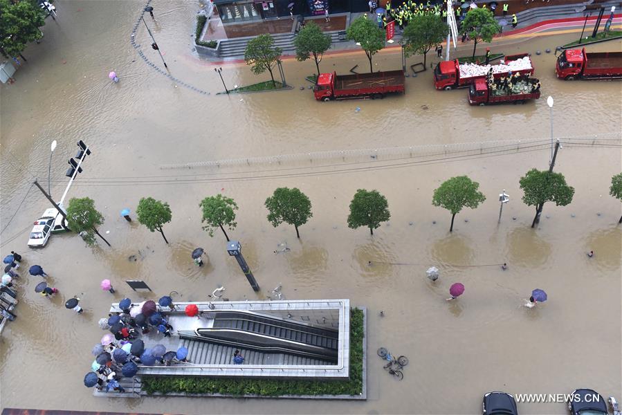 The downpour caused severe waterlogging as rivers, lakes and reservoirs of the city have swollen, leading to closure of a tunnel across the Yangtze as well as some subway stations and underground passages, according to local traffic authorities. 