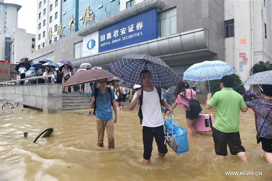 The downpour caused severe waterlogging as rivers, lakes and reservoirs of the city have swollen, leading to closure of a tunnel across the Yangtze as well as some subway stations and underground passages, according to local traffic authorities. 