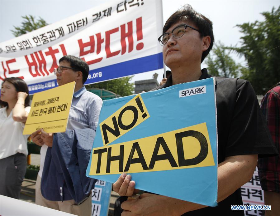 Local residents take part in a protest against the decision to deploy the Terminal High Altitude Area Defense (THAAD), in Seoul, South Korea, July 8, 2016. 