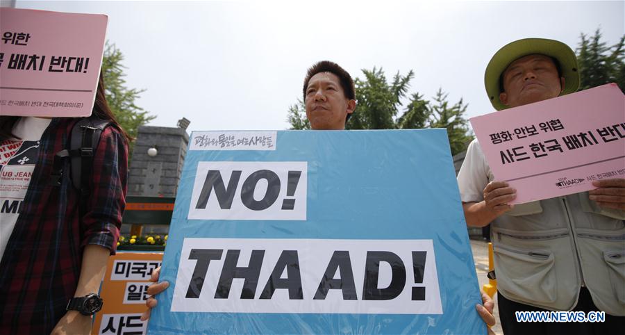 Local residents take part in a protest against the decision to deploy the Terminal High Altitude Area Defense (THAAD), in Seoul, South Korea, July 8, 2016. 