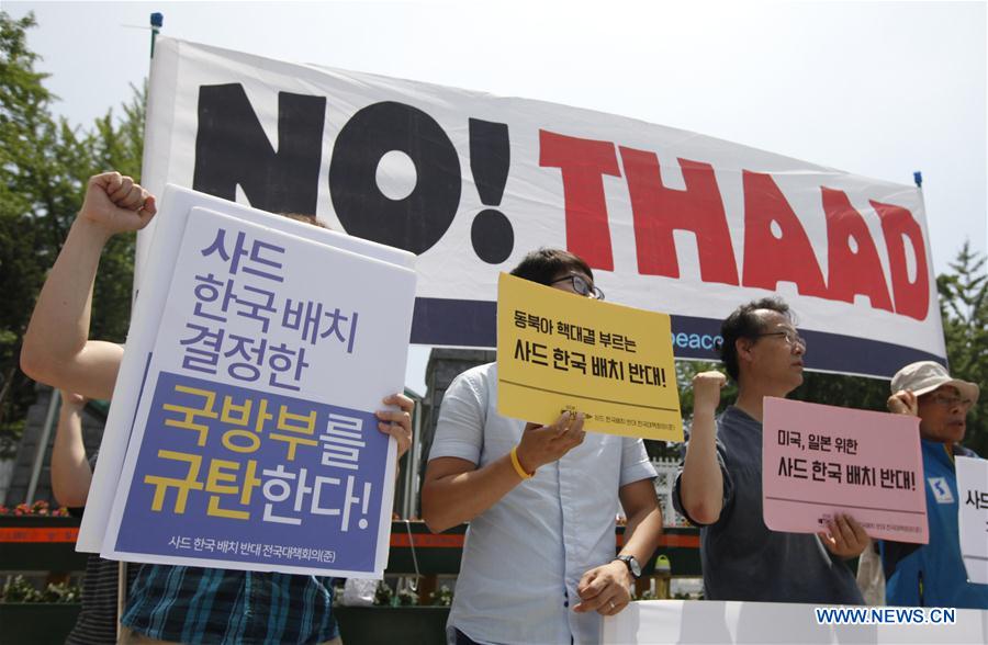 Local residents take part in a protest against the decision to deploy the Terminal High Altitude Area Defense (THAAD), in Seoul, South Korea, July 8, 2016. 