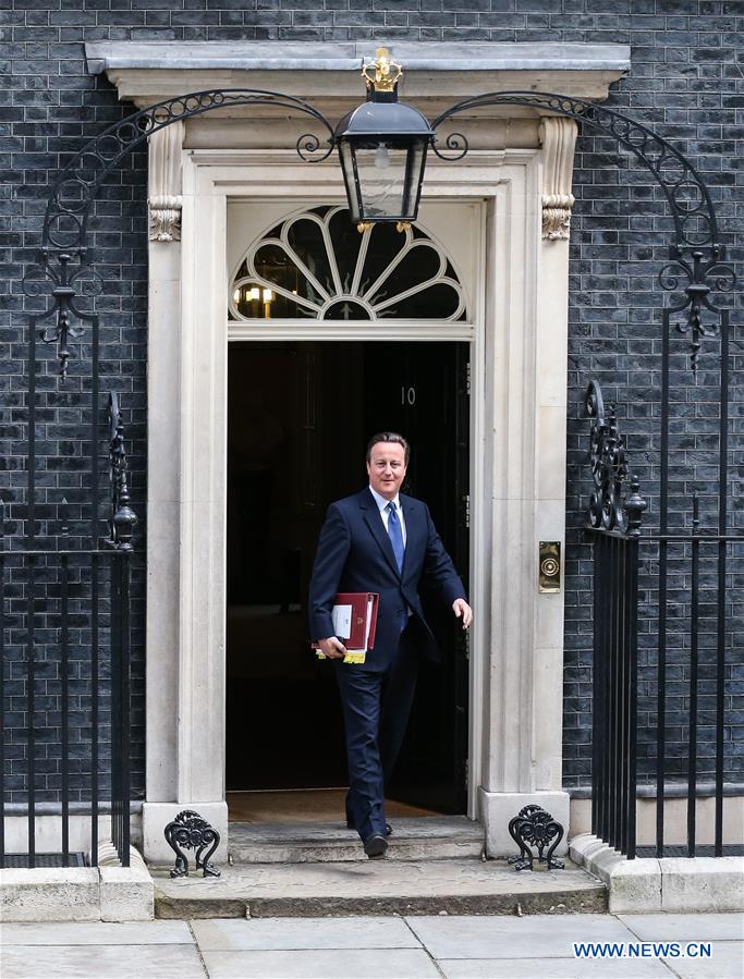 British Prime Minister David Cameron (1st L) leaves 10 Downing Street for his last Prime Minister's Questions in London, Britain, on July 13, 2016.