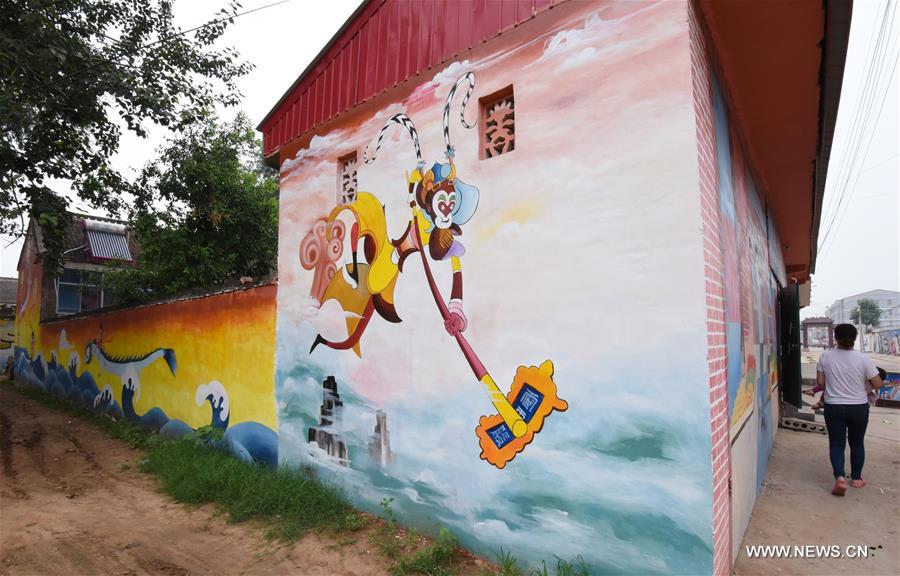 This year, local government decorated the Qiannanbu village with cultural graffiti works to improve the scenery. 