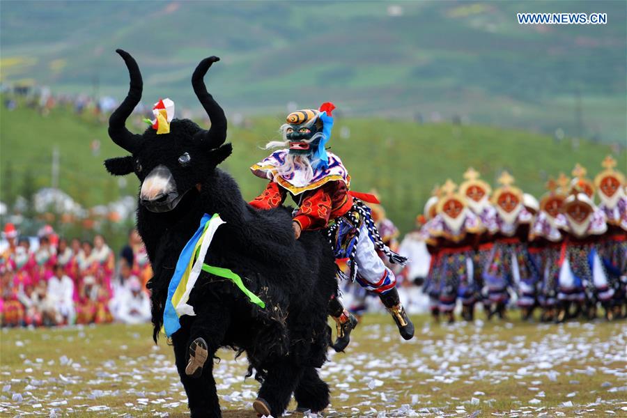 Dancers perform Tibetan drama at the opening ceremony of Shambhala Tourism Festival in Gannan, northwest China's Gansu Province, July 17, 2016. 