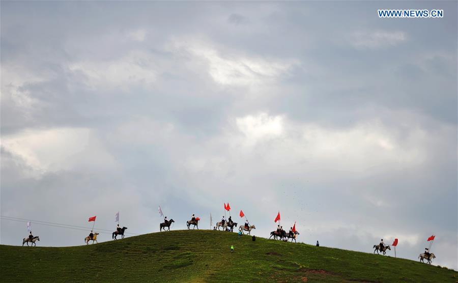 Riders perform at the opening ceremony of Shambhala Tourism Festival in Gannan, northwest China's Gansu Province, July 17, 2016. 