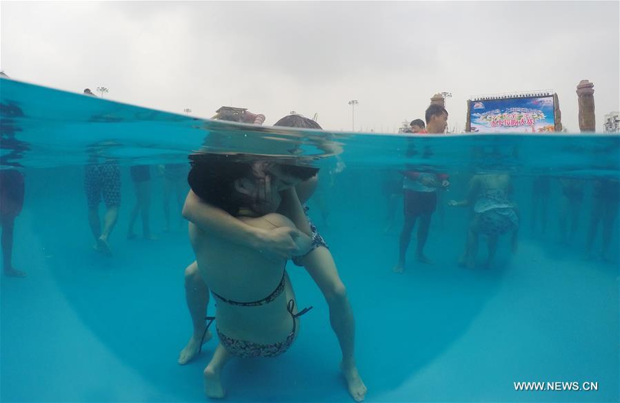 The competition attracted 15 couples kissing for the award. 