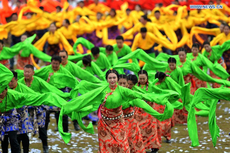 People dance at the opening ceremony of Shambhala Tourism Festival in Gannan, northwest China's Gansu Province, July 17, 2016. 