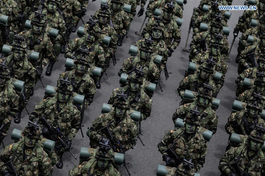 Soldiers take part in a military parade during a commemoration of the 206th anniversary of Independence, in Bogota, Colombia, on July 20, 2016.