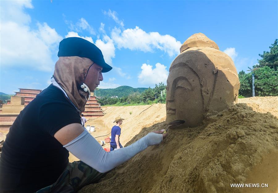 The sand sculptures here are expected to open to the public on Sept. 9. 