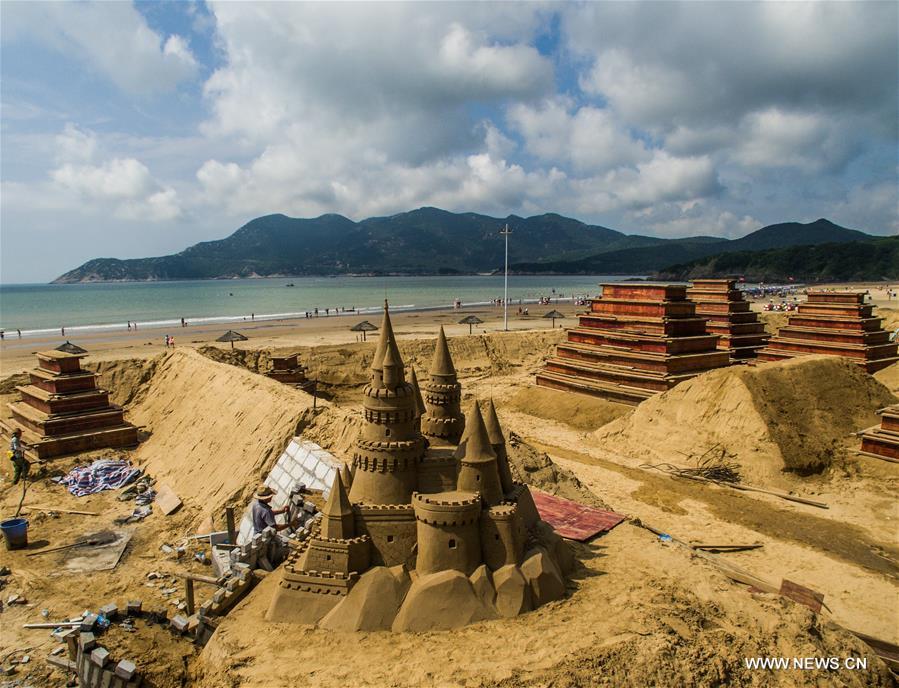 The sand sculptures here are expected to open to the public on Sept. 9. 