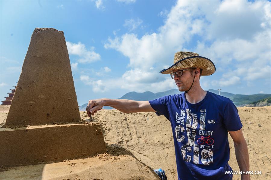The sand sculptures here are expected to open to the public on Sept. 9. 