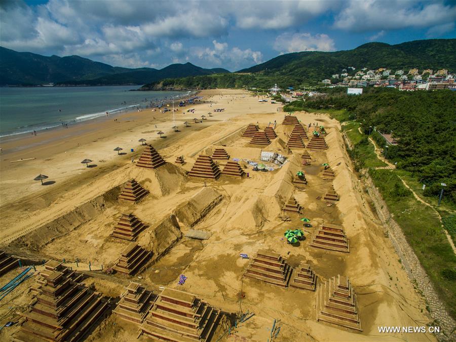 The sand sculptures here are expected to open to the public on Sept. 9. 
