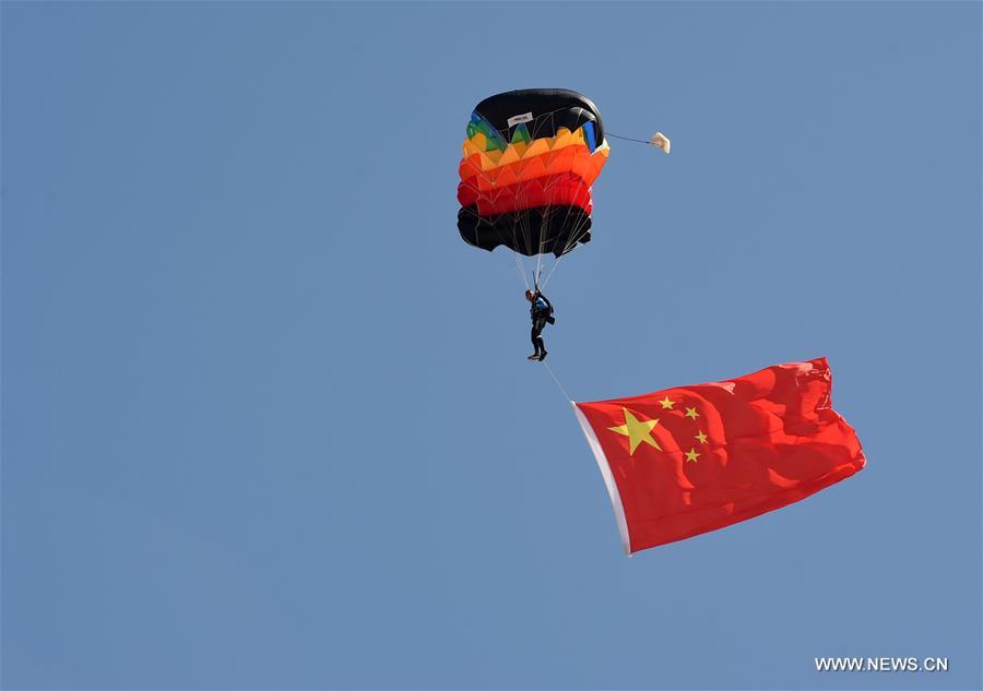 Planes take part in the aerobatics performance at an international general aviation convention in Zhangye City, northwest China's Gansu Province, Aug. 26, 2016.