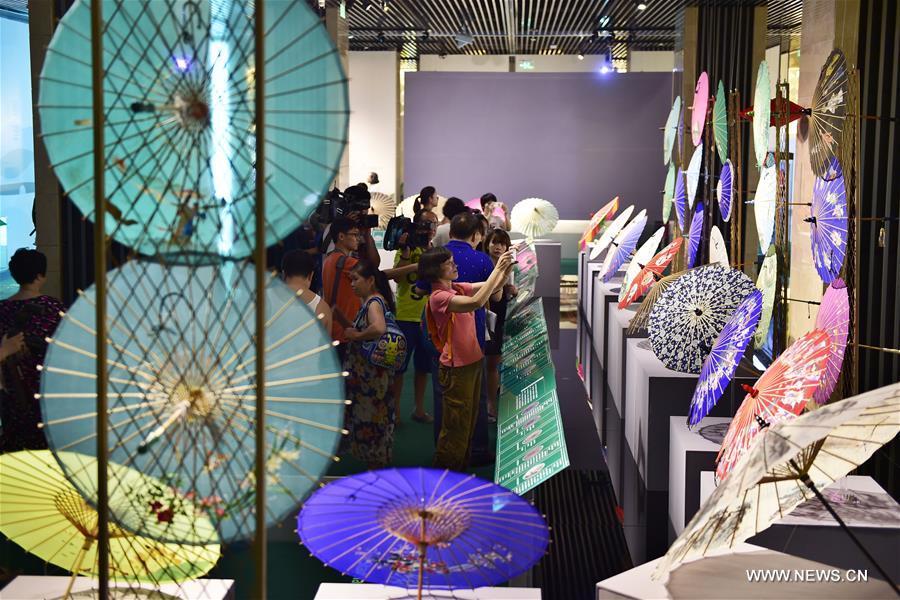 Traditional materials and tools used for making silk umbrellas are displayed during a West Lake silk umbrella show in Hangzhou, capital of east China's Zhejiang Province, Aug. 26, 2016. 