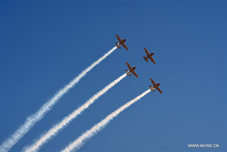 Planes take part in the aerobatics performance at an international general aviation convention in Zhangye City, northwest China's Gansu Province, Aug. 26, 2016.