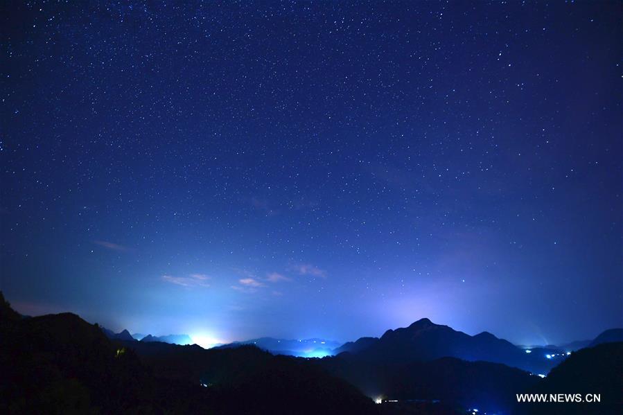 Photo taken on Aug. 25, 2016 shows starry sky in Jiulong Waterfall Scenic Spot of Luoping, southwest China's Yunnan Province.