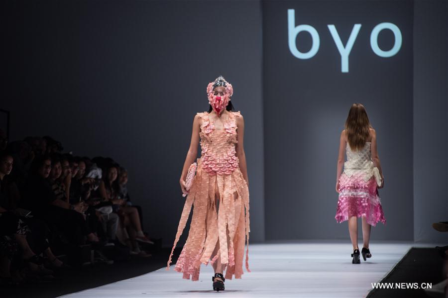 A model presents a design by Byo during the Jakarta Fashion Week in Jakarta, Indonesia, Oct. 22, 2016. 