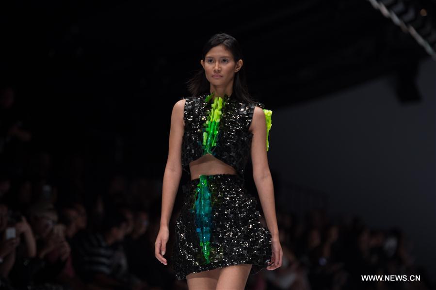 A model presents a design by Byo during the Jakarta Fashion Week in Jakarta, Indonesia, Oct. 22, 2016. 